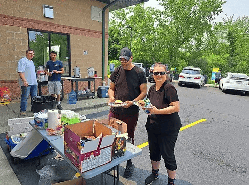 Cheerleader greeting customers
